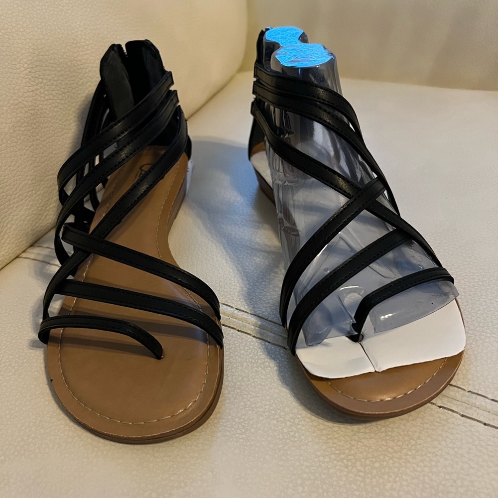 Strapped sandals. One inch heel. Brand new. Black in color.
